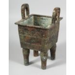A GOOD ARCHAIC BRONZE CENSER with handles on four legs. 9ins high.