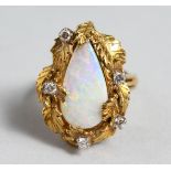 A GOOD 18CT GOLD TIER DROP OPAL AND DIAMOND RING.