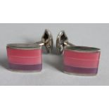 A PAIR OF SILVER AND ONYX CUFF LINKS