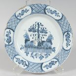 AN 18TH CENTURY BLUE AND WHITE TINE GLAZE CHARGER (A/F). 12ins diameter.