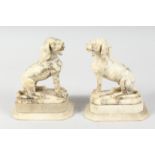 A PAIR OF 19TH CENTURY, AFTER THE ANTIQUE, ALABASTER DOGS on plinths. 6ins