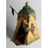 A GOOD AUSTRIAN PAINTED COLD CAST ARAB TENT, a seated figure inside. 13ins high.