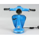 A BLUE VESPA LAMP.