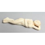 A CARVED BONE DOCTOR'S NUDE FIGURE. 3.5ins long.