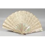 A GOOD VICTORIAN MOTHER OF PEARL AND LACE FAN. 20ins open, in a box. J Duvellerux, Paris & London.