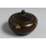 A CHINESE PIERCED TOP GOLD SPLASH CENSER. Signed. 2.75ins diameter.