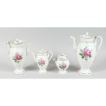 A FOUR PIECE MEISSEN PORCELAIN TEA SET, painted with roses. Cross swords mark in blue.