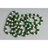 A LONG STRING OF JADE AND PEARL BEADS. 46ins long.