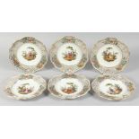 A GOOD SET OF SIX PLATES with pierced borders, the centres painted with figures. 8ins diameter.