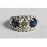 A SUPERB 18CT GOLD, SAPPHIRE AND DIAMOND THREE STONE RING.