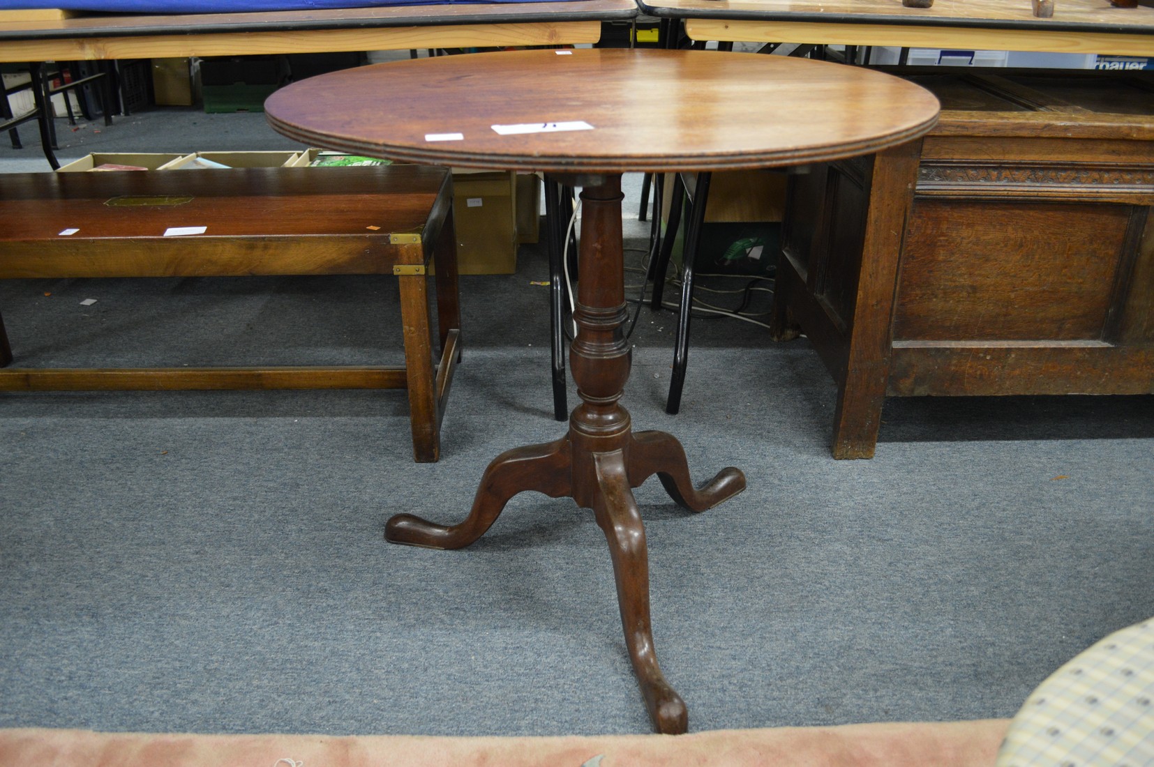 A George III mahogany circular tilt top tripod table.