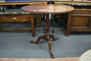 A George III mahogany circular tilt top tripod table.