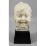 A GOOD ITALIAN CARED WHITE MARBLE BUST OF A CHILD. 8.5ins high.