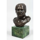 AFTER THE ANTIQUE. A BRONZE BUST. 4ins high on a marble plinth.