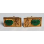 A PAIR OF 14CT GOLD AND JADE CUFF LINKS with Chinese calligraphy.
