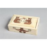 A BONE DICE BOX etched with teddy bears. 3.5ins long.