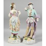 A GOOD PAIR OF CONTINENTAL FIGURES OF A YOUNG GALLANT AND A YOUNG GIRL on encrusted bases. 17ins