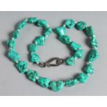 A TURQUOISE BEAD NECKLACE 18ins long.
