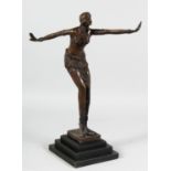 A BRONZE DECO DANCER on a stepped base. 17ins high.