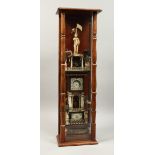 A VERY RARE AMERICAN SCRIMSHAW WATCH TOWER, with five tiers with a figure holding a watch, the