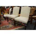 A pair of George III style cream upholstered side chairs.