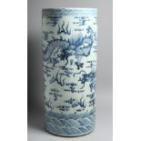 A CHINESE BLUE AND WHITE STICK STAND decorated with dragons. 24ins high.