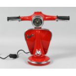 A RED VESPA LAMP.