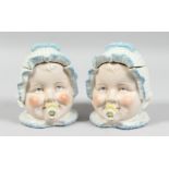 A PAIR OF BABY'S HEADS BOXES. 5ins high.
