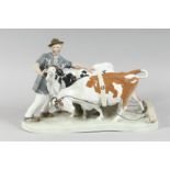 A LARGE MEISSEN GROUP, FARMER WITH TWO COWS. 16ins long, 11ins high. Cross swords mark in blue,