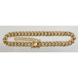 AN 18CT GOLD BRACELET.