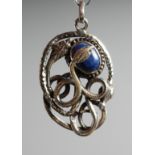 A SILVER AND LAPIS SNAKE PENDANT.