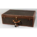 A VERY GOOD LOUIS VUITTON SUITCASE. No. 980532, with inside tray. Brass lock no. 1084879. 31ins long