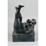 AFTER H. MOORE. A BRONZE MOTHER AND CHILD on a rectangular base. 13ins high.