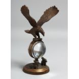 A SMALL EAGLE CLOCK. 8ins diameter.