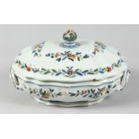 AN 18TH - 19TH CENTURY FRENCH ROUEN POTTERY TUREEN AND COVER decorated with a bunch of flowers.