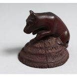 A JAPANESE CARVED WOOD NETSUKE BOAR. 1.75ins.