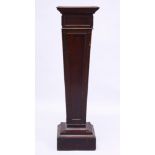 A MAHOGANY TAPERING STAND 3ft high.