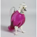 A SMALL PINK GLASS PARROT CLARET JUG with plated head.