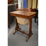 A good Victorian figured walnut worktable with rising top enclosing a fitted interior above a