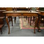 A 19th century French walnut or fruitwood single drawer dining table.