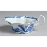 AN EARLY BOW SAUCE BOAT with flat unglazed base and unusual handle painted in underglaze blue,