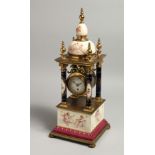 A VERY GOOD 19TH CENTURY VIENNA PORCELAIN CLOCK with four column supports and painted with cupids.