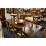 A good William IV mahogany extending dining table with two leaves on carved and turned legs.