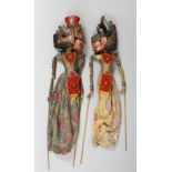 A PAIR OF BALINESE CARVED WOOD FOLK ART PUPPETS, carved figures approx. 57cm long.