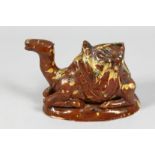 A TURKISH CANAKKALE GLAZED POTTERY FIGURE OF A CAMEL, 16cm long.