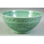 A LARGE CHINESE CELADON GLAZE PORCELAIN BOWL, with floral decoration, the inner rim with greek key