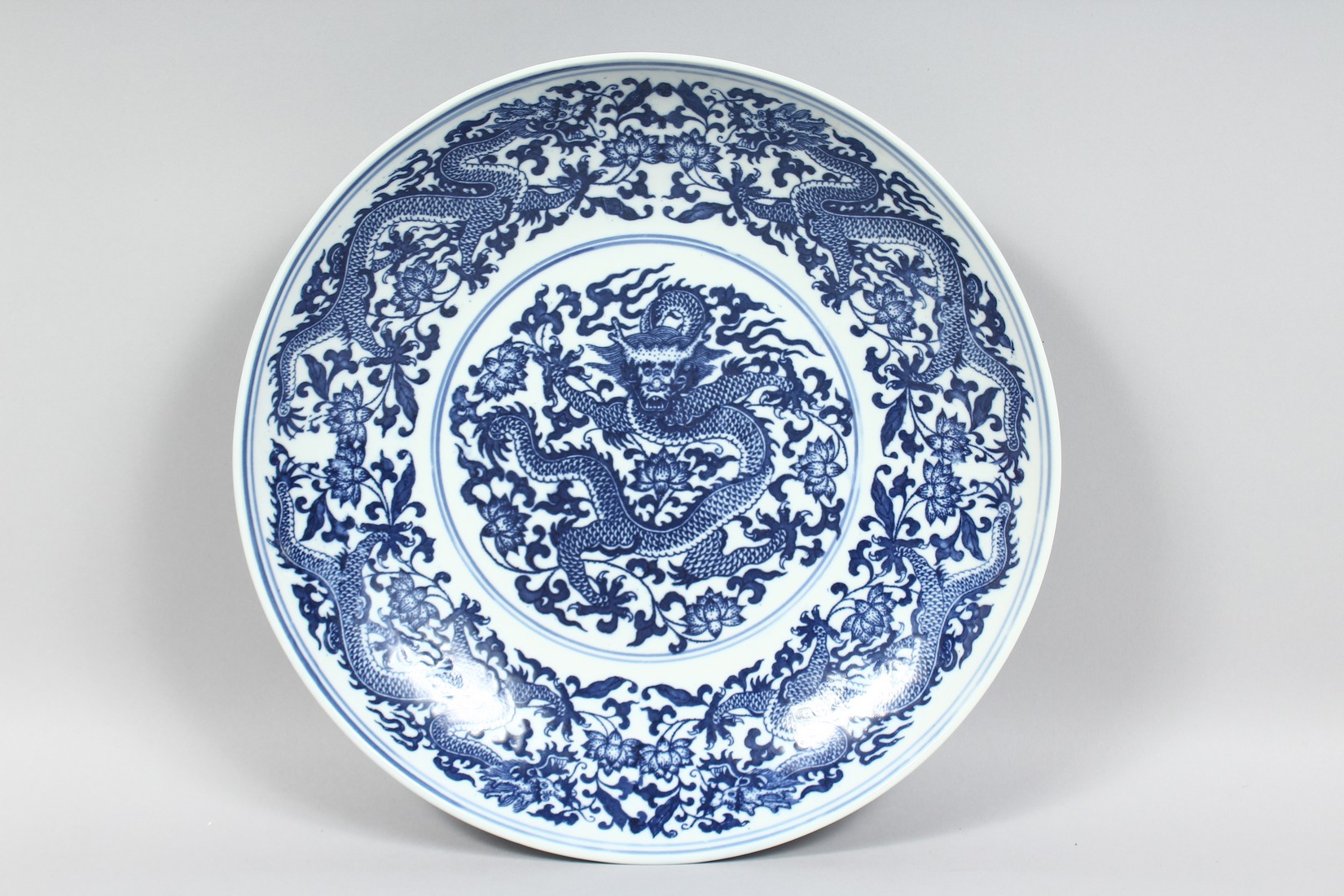 THREE LARGE CHINESE PORCELAIN DISHES, comprising two blue and white and one yellow ground dish; each - Image 2 of 8