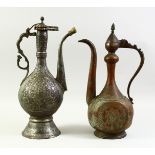 TWO ISLAMIC COPPER EWERS, each with engraved decoration. Tallest 42cm high, the other 40.5cm
