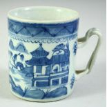 A CHINESE BLUE AND WHITE PORCELAIN TANKARD, decorated with a landscape scene, 11cm high.