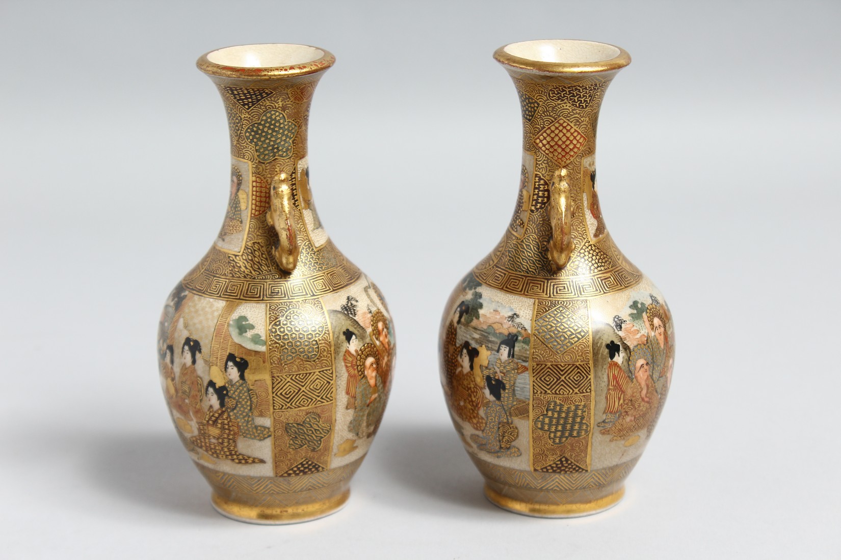 A PAIR OF SMALL JAPANESE SATSUMA PORCELAIN TWIN HANDLE VASES, painted with figures and gilt - Image 4 of 6